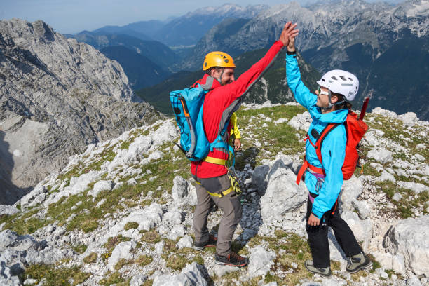Mountaineers celebrating on the top stock photo