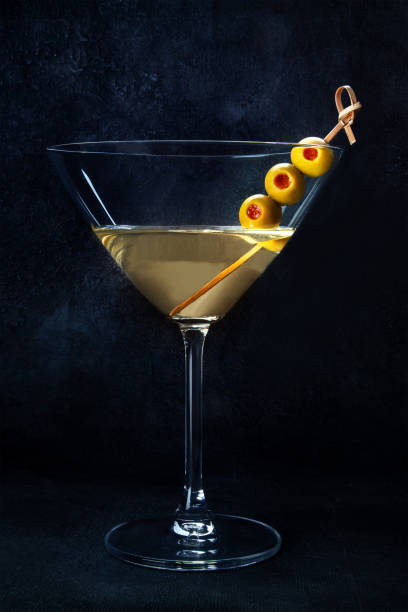 martini. a glass of dirty martini cocktail with vermouth and olives, aperitif - martini martini glass dirty martini olive ストックフォトと画像