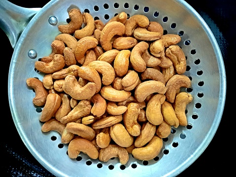 Fried Cashew Nut in colander.