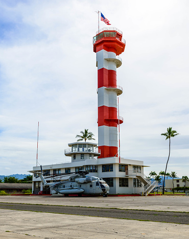 An Air control Tower with military helicopter on Ford Island Pearl Harbor Hawaii USA.
