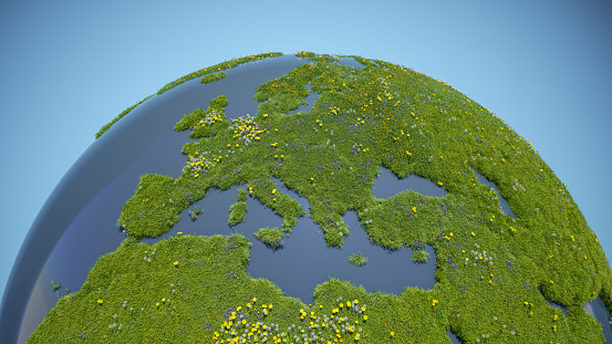 A detailed, conceptual illustration of a green globe covered in lush, vibrant grass, interspersed with a variety of colorful flowers blooming across its surface.\n(World Map Courtesy of NASA: https://visibleearth.nasa.gov/view.php?id=55167)