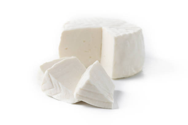istock Sliced fresh white cheese from cow's milk isolated on white background 2062885089