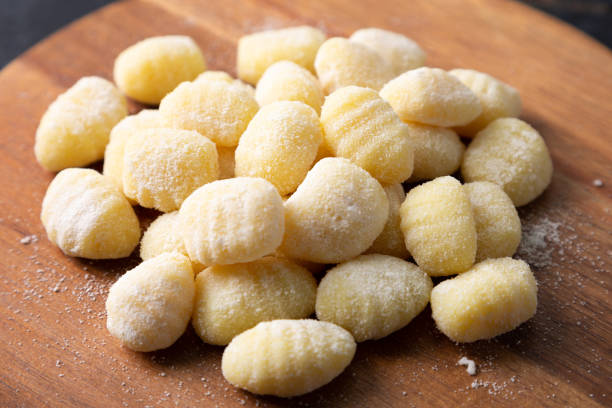 istock Raw gnocchi heap on a wooden board 2062887212