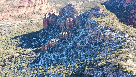 A scenic view of snow-covered mountains in Sedona, AZ during winter
