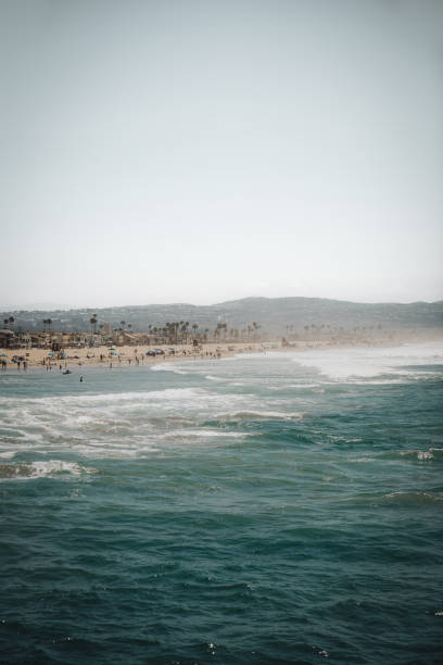 A scenic ocean view with a sandy beach in the distance