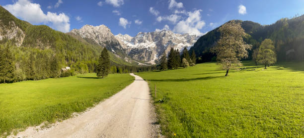 Zgornje Jezersko valley in Slovenia during a beautiful springtime day with the mountain range in the Kamnik–Savinja Alps.