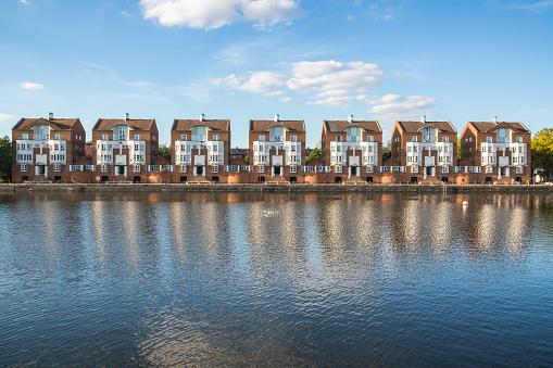 A row of waterfront houses at Greenland Dock in London, UK