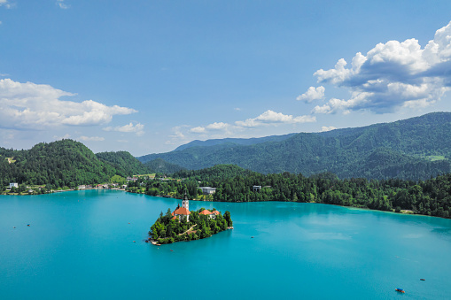 Lake Bled with the Bled island, in Gorenjska (Upper Carniolan region), Slovenia, during a beautiful springtime day. High angle drone point of view.