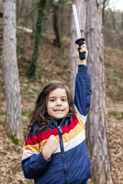 istock Little boy is having fun and playing in the public park, making funny faces. 2062909582