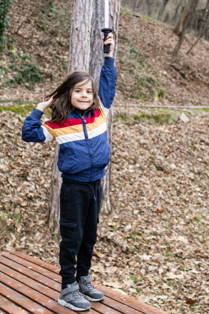 istock Little boy is having fun and playing in the public park. 2062922154