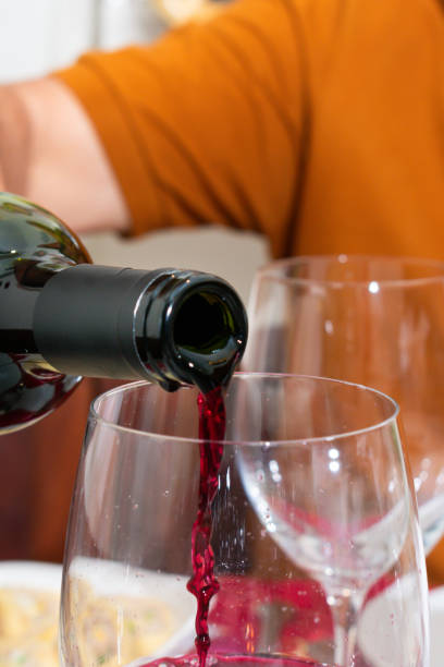 istock Elderly Gentleman Pouring Red Wine into Glass 2062928119