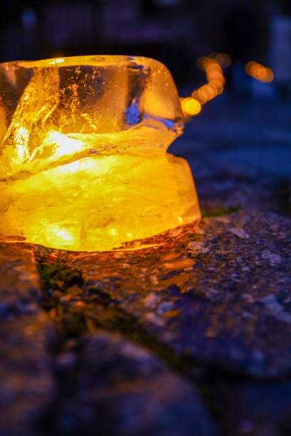 Ice lanterns that illuminate the road at night in winter.