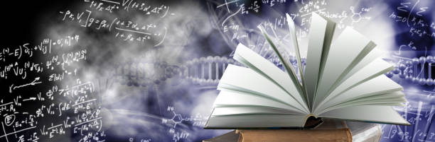 istock An open book symbolizing the source of knowledge. A book lying on a stack of books. 2062929192
