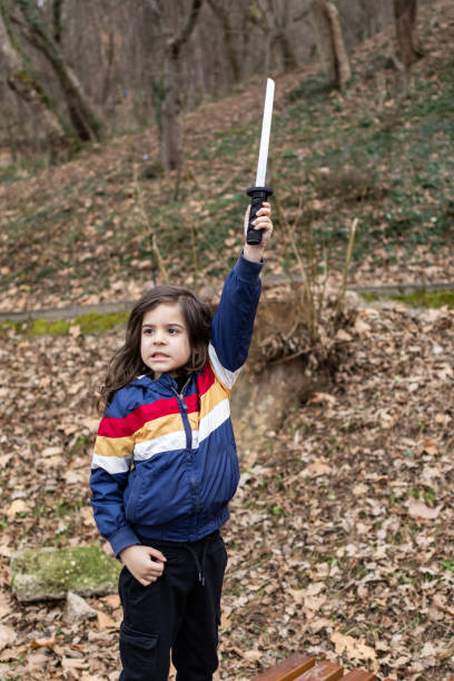 istock Little boy is having fun and playing in the public park, making funny faces. 2062930323