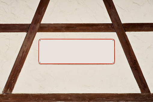 A Blank plate on a half-timbered wall