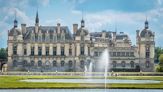Chantilly, France – May 24, 2023: A scenic view of the stunning Chateau de Chantilly in France