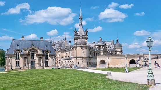 Chantilly, France – May 25, 2023: A scenic view of the stunning Chateau de Chantilly in France