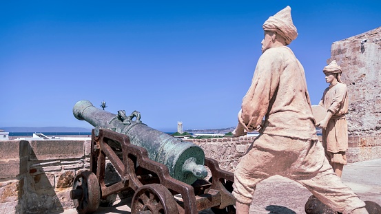 Tanger, Morocco – July 21, 2023: The Tangier Fortifications Interpretation Center with a seaside cannon and statues in Tanger, Morocco