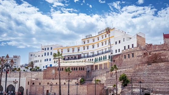 Tanger, Morocco – July 20, 2023: A charming castle-like structure amid towering buildings during daytime in Tanger, Morocco