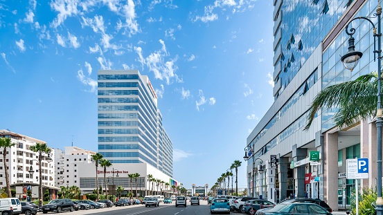 Tanger, Morocco – July 20, 2023: A busy street in Tanger, Morocco with modern architecture and cars