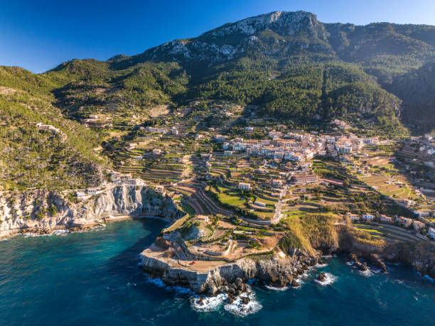Aerial view of Banyalbufar in Mallorca on a sunny day An aerial view of Banyalbufar in Mallorca on a sunny day banyalbufar stock pictures, royalty-free photos & images