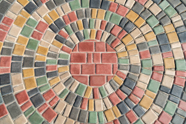 Colored stones on the cobble alleys and footpaths of Passau, Germany lead tourists and locals to various artist shops. The stones were painted to create interest and increase business for the local artists in Hollglasse Artists Alley.