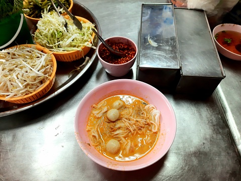 Eating Rice Noodle in Curry Soup with Fish meatballs - Bangkok Street Food.