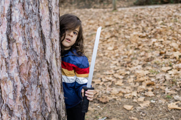 istock Little boy is having fun and playing in the public park. 2062966337
