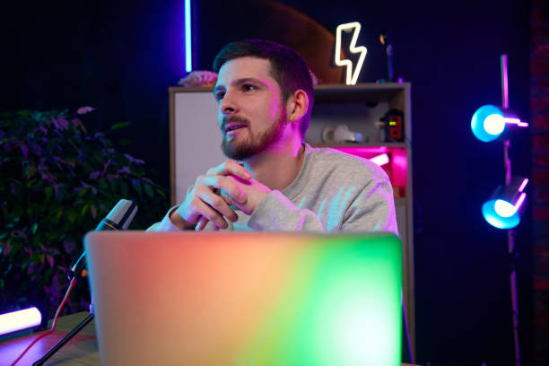 istock Young man, blogger taking part in online podcast show, giving interview, discussing interesting lifestyle topics 2063062835