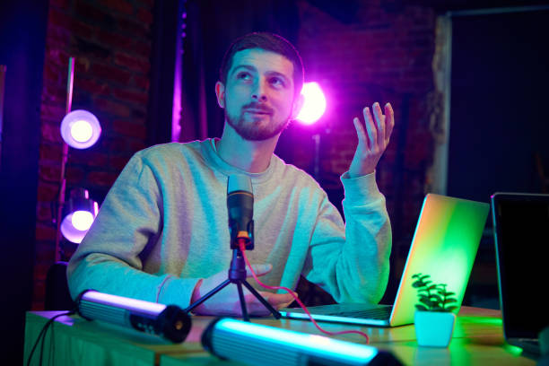 istock Young man, blogger taking part in online podcast show, giving interview, discussing interesting lifestyle topics 2063062852