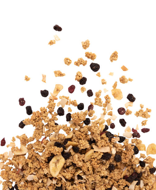 heap of muesli or crunchy granola isolated on white - granola cereal breakfast stack - fotografias e filmes do acervo