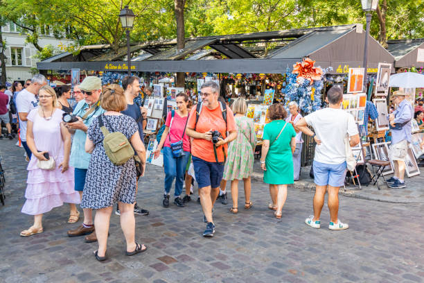 Paris, France - September 10, 2023 : Tourists visiting the Place du Tertre square in Montmartre