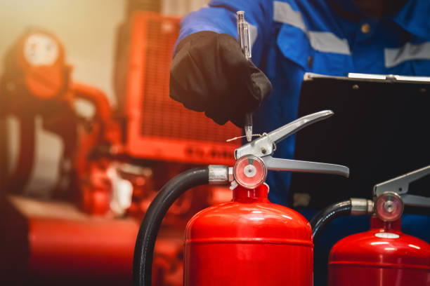 istock Engineer check fire extinguisher tank in the fire control room for safety in factory or industry. 2063081721
