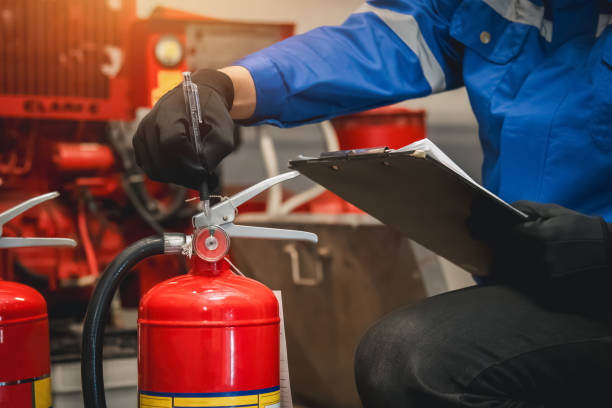istock Engineer check fire extinguisher tank in the fire control room for safety in factory or industry. 2063081722