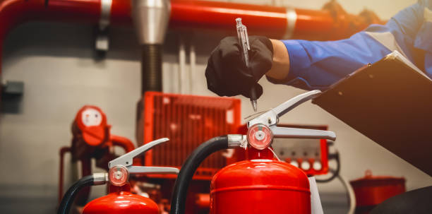 istock Engineer check fire extinguisher tank in the fire control room for safety in factory or industry. 2063081723