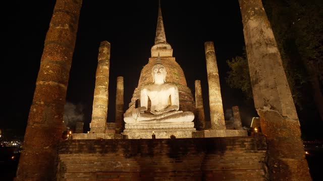 Wat Mahathat at Sukhothai Historical Park in Sukhothai, Thailand. Sukhothai history park at most beautiful landmark. Thai buddhist temple architecture at night. Tourist attraction