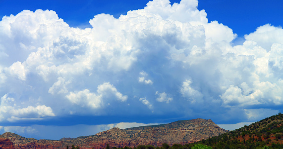 Firey orange and red cloudy sky over desert mountain range