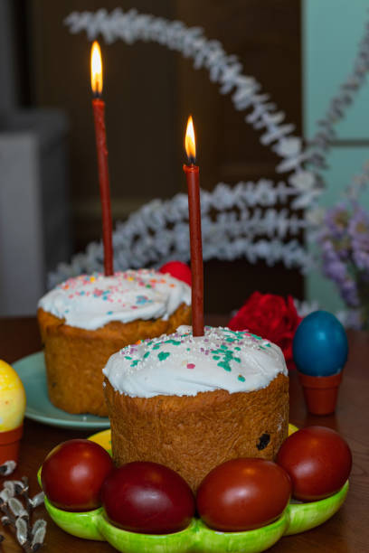 istock Elegant Easter cakes with burning candles on the dining table 2063102964