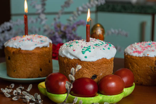 istock Elegant Easter cakes with burning candles on the dining table 2063103448