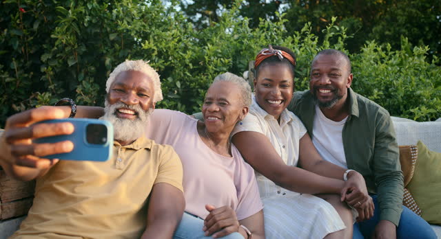 Black family, senior and selfie with photography on sofa for capture, bonding or moment in nature. Happy African group with smile for photo, picture or social media in relax on outdoor couch together