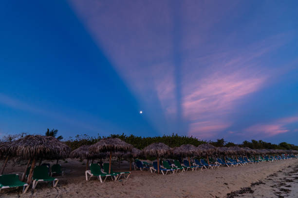 Sunrise on the ocean shore in the morning. Colorful sunrise on the shores of the Atlantic Ocean (Gulf of Mexico) during the rain season (June) in Varadero, Cuba.