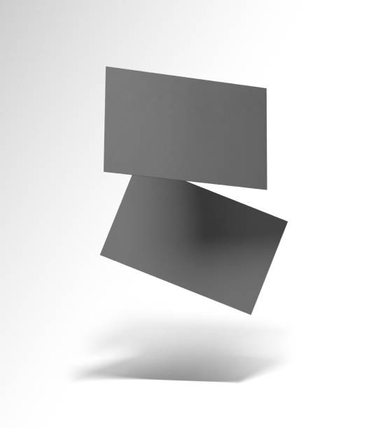 istock Gray contact card. A business card floats in the air. Two dark cardboard rectangles fly on a white background. Contact card, mockup, mockup, blank card, gray black object, 2063147443