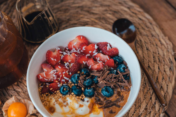 istock Oatmeal topped with fruit yogurt Chocolate and bee pollen 2063163400