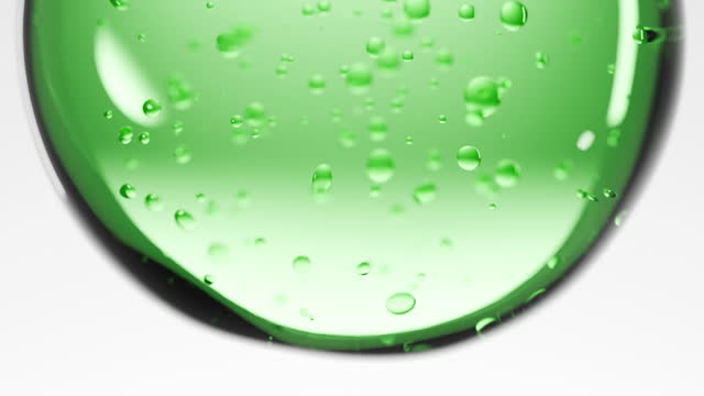 Close-up green realistic liquid and bubble