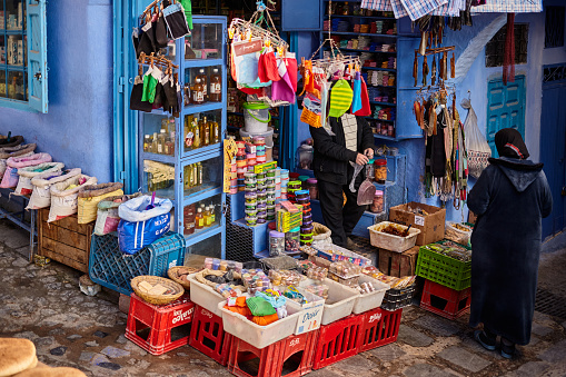 Shopping street local store in blue city of Chefchaouen, Morocco, North Africa.