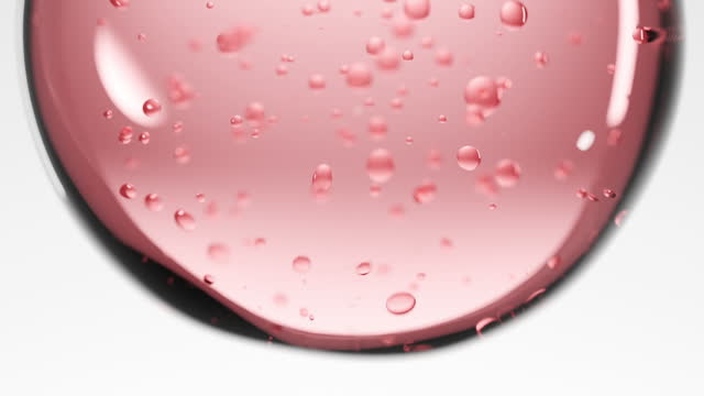 Close-up pink realistic liquid and bubble