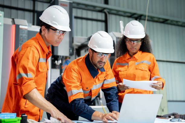 istock Multiracial engineer team collaborates in a factory brainstorm, uniting diverse skills for innovative solutions. 2063182968