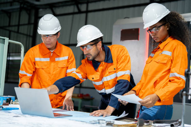 istock Multiracial engineer team collaborates in a factory brainstorm, uniting diverse skills for innovative solutions. 2063186248
