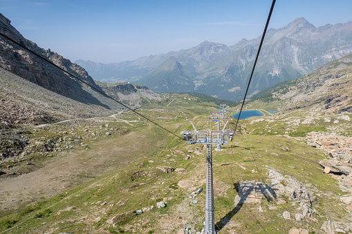 skiing in Alps, ski lift cabine and beautiful mountain panoramic landscape