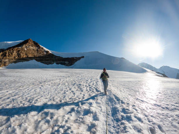 istock Alpinist moving down from mountain summit 2063222935